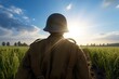 Landscape with World War II soldier from behind, field in the background. Generative AI
