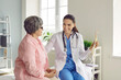© Studio Romantic - Doctor showing spine model to senior woman patient. Friendly, smiling medical specialist talking to old lady, telling about skeleton diseases, and showing orthopedic anatomical backbone model