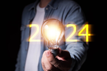 Fototapete - Innovation. Business man hand holding light bulb for Concept of new idea concept with innovation and inspiration, innovative technology in science and communication concept