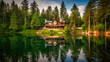 A stunning image of a sophisticated lakeside cabin, exuding tranquility and the epitome of a luxurious summer escape.