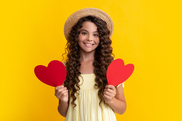 Wall Mural - Young teenager child girl with heart shape. Happy Valentines Day. Love and pleasant feelings concept. Happy teenager, positive and smiling emotions of teen girl.