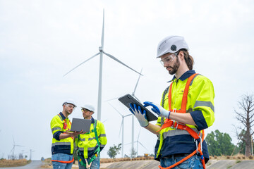 Poster - Engineer working at the natural energy wind turbine site,Wind turbine operations that transform wind energy into electrical electricity,Clean energy concept saves the world.