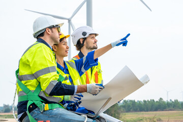 Poster - Technician Engineer in uniform are checking wind turbine power farm, Power generator station,Clean energy and environment.