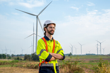 Wall Mural - Engineer inspection and survey work in wind turbine farms rotation to generate electricity energy.