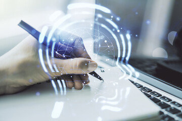 Poster - Creative artificial Intelligence concept with human head hologram and hand writing in notebook on background with laptop. Multiexposure
