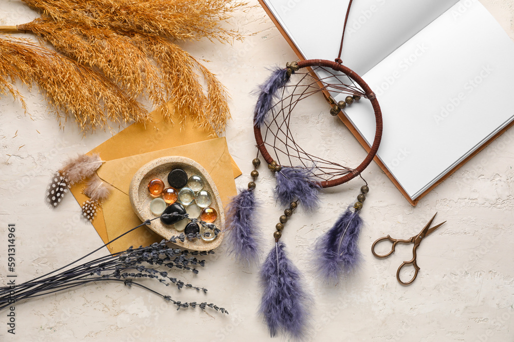 Dream catcher, glass stones, pampas grass and book on white background