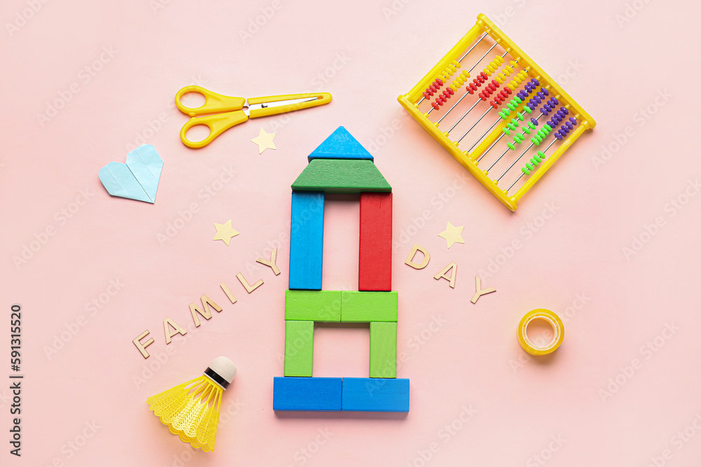 Text FAMILY DAY with toys on pink background
