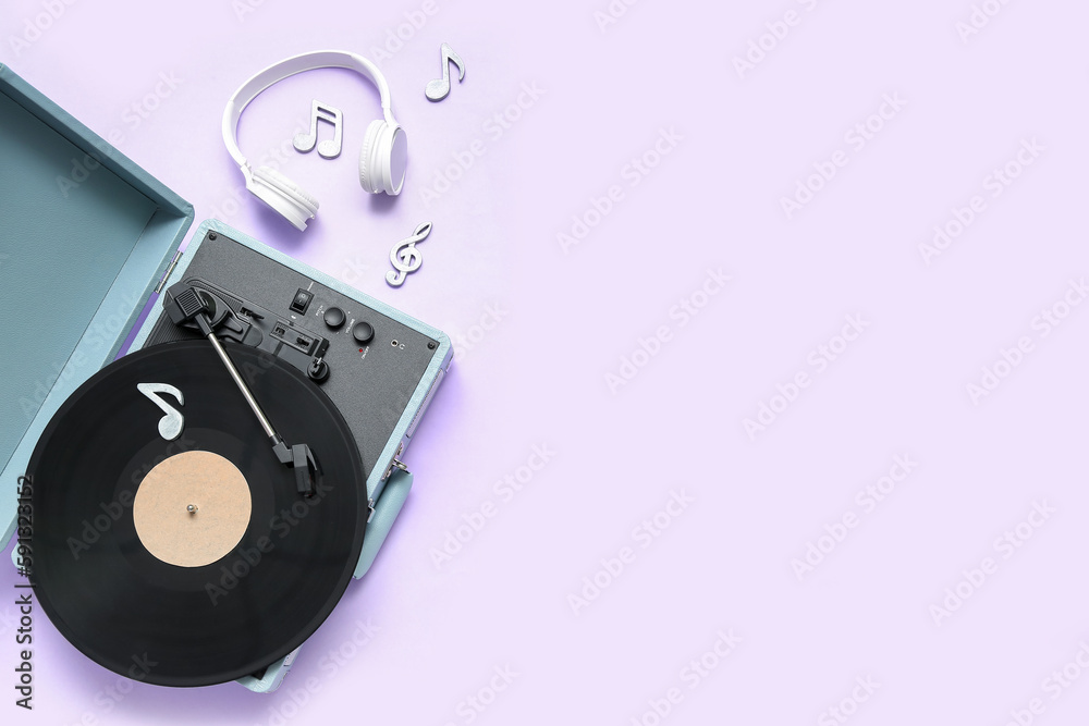 Record player with vinyl disk, headphones and note signs on lilac background