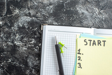 Wall Mural - top view start note with copybook and pen on gray background study paper school lesson student stick