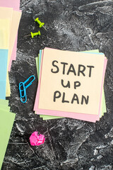 Wall Mural - top view start up plan note on sticker on a gray background lesson student note school paper study s
