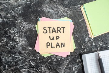 Wall Mural - top view start up plan note on sticker on gray background lesson student note paper study sticker no