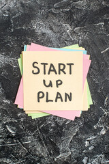 Wall Mural - top view start up plan note on sticker on gray background lesson student paper study sticker notepad