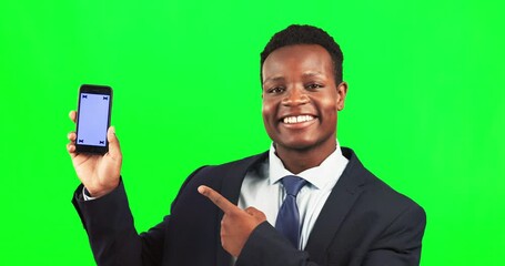 Wall Mural - Phone, mockup and man in studio with green screen pointing at space for advertising or marketing. Happy, portrait and African male model showing mock up on cellphone isolated by chroma key background