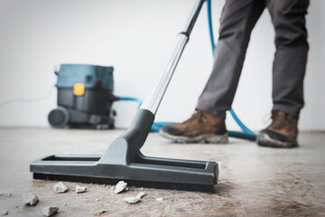 professional construction cleaning service with powerful vacuum cleaner.