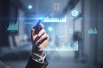 Aufkleber - Close up of man hand with pen pointing at glowing digital business interface with charts on blurry office interior background. Infographic and big data concept. Double exposure.