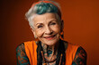 © alexkoral - portrait of stylish elderly happy woman in tattoos smiling on bright colored background. Generative AI