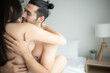 © Wosunan - Gorgeous sexy couple enjoying sex on bed in the house's bedroom, Concept of as emotional relationships passion and love