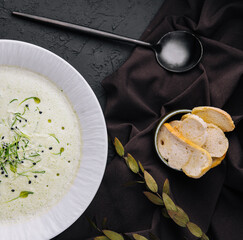 Wall Mural - Champignon mushroom cream soup in white plate with pastry