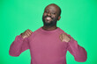 © pressmaster - Portrait of African American happy man pointing at himself with proud and smiling at camera standing against green background