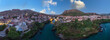 Aerial view of city of Mostar in Bosnia and Herzegovina and it's landmarks (Neretva river, Old bridge, Koski Mehmed Pasha Mosque).