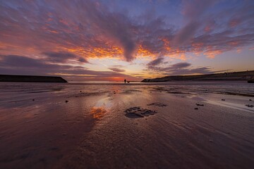 Picturesque view of sunrise over Cullercoats bay beach