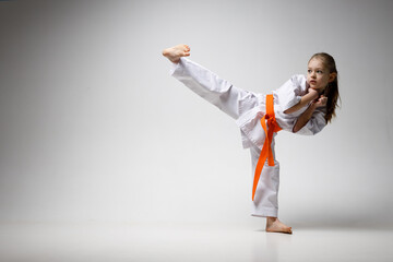 Teaching children self-defense in karate.