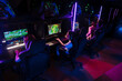 © Drobot Dean - Team of gamers playing online game on championship in cybersport club