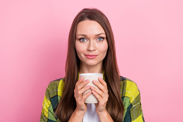 Wall Mural - Photo of pleasant gorgeous nice woman with long hairstyle wear checkered shirt hold cup of coffee isolated on pink color background