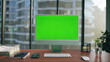 © stockbusters - Computer monitor mockup placed desk closeup. Green screen pc modern workplace