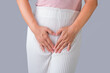 © scentrio - Woman with hands on her crotch isolated on white background. Female hand holding her crotch with pelvic pain or vaginal itching. gynecological problems. Health hygiene concept