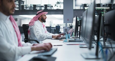 Poster - Portrait of a Middle Eastern Engineer Working on Desktop Computer in a Technological Office Environment. Arab Software Developer Researching New Ideas to Problem Solve a Technical Assignment