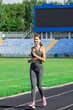 young fitness woman runner running on stadium track. Training in the morning time. People sport and fitness concept