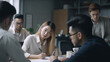 © Ann Stryzhekin - Asian young people working in the office. Generative AI. Faces generated AI , unreal non-existent people.