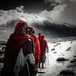 A dramatic black and white photograph of a group of Maasai warriors trekking up the side of Mount Kilimanjaro, with their vibrant red clothing. Image created with Generative AI technology