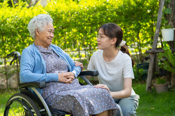 Wall Mural - caregiver help and care Asian senior woman patient sitting on wheelchair at nursing hospital ward, healthy strong medical concept.