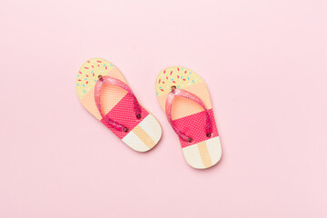 Wall Mural - Bright flip flops on color background, top view