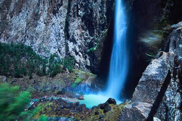 waterfall at moonlight in the night with sky full of stars, high wall of stone in basaseachi chihuahua	