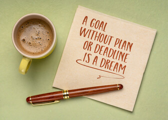 Wall Mural - A goal without plan or deadline is a dream. Inspirational note or reminder on a napkin with coffee.