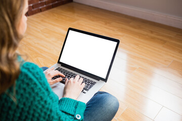 Poster - Woman sitting on floor while using her laptop