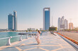 © EdNurg - Strolling along the Abu Dhabi Corniche, a scenic waterfront promenade with stunning views of the Arabian Gulf and the city's iconic skyscrapers, is a must-do for any visitor to the UAE's capital.