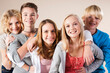 © Designpics - Portrait of Group of Teenage Boys and Girls Smiling at Camera, Studio Shot on White Background