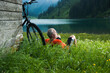 © Designpics - Mature Man with Mountain Bike Relaxing by Lake, Vilsalpsee, Tannheim Valley, Tyrol, Austria