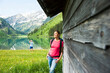 © Designpics - Couple Hiking by Lake, Vilsalpsee, Tannheim Valley, Tyrol, Austria