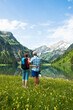 © Designpics - Couple Hiking by Lake, Vilsalpsee, Tannheim Valley, Tyrol, Austria