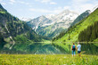 © Designpics - Couple Hiking by Lake, Vilsalpsee, Tannheim Valley, Tyrol, Austria