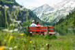 © Designpics - Couple Sitting on Bench by Lake, Vilsalpsee, Tannheim Valley, Tyrol, Austria