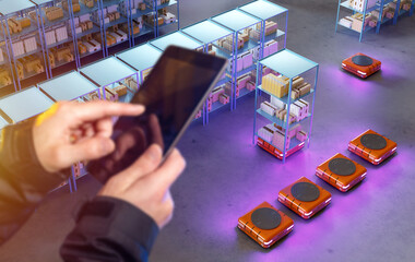 Poster - Man's hands with tablet. Guy controls warehouse robots. Storekeeper is engaged in automation. Introductio AGV technology. Automation of production processes. Warehouse machines for moving trolleys