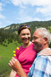 © Designpics - Mature Couple Relaxing at Lake, Vilsalpsee, Tannheim Valley, Tyrol, Austria