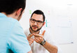 © Designpics - Close-up of two young businessmen meeting and in discussion, Germany