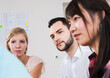 © Designpics - Close-up of group of young business people meeting and in discussion in office, Germany